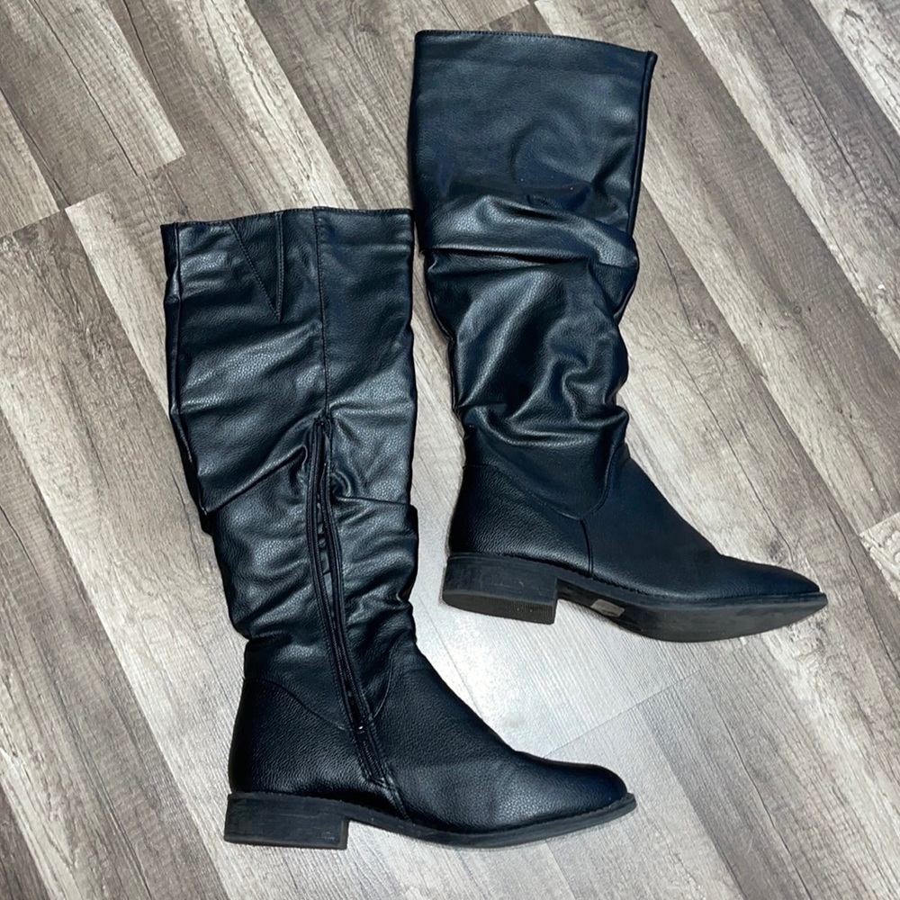 Black high boots.